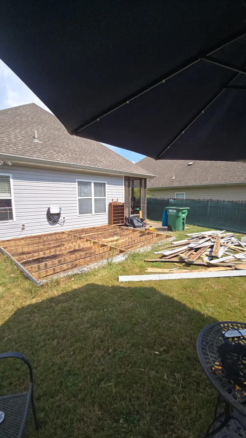 A backyard deck torn up during removal