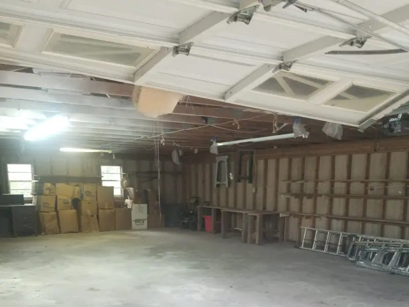 A big garage emptied out, boxes stacked to one side