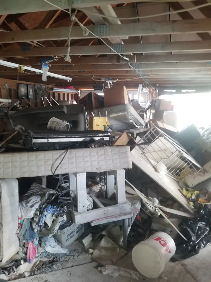 A garage packed wall to wall before a cleanout