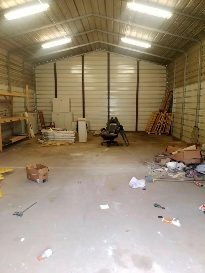 An empty metal storage building after the load-out