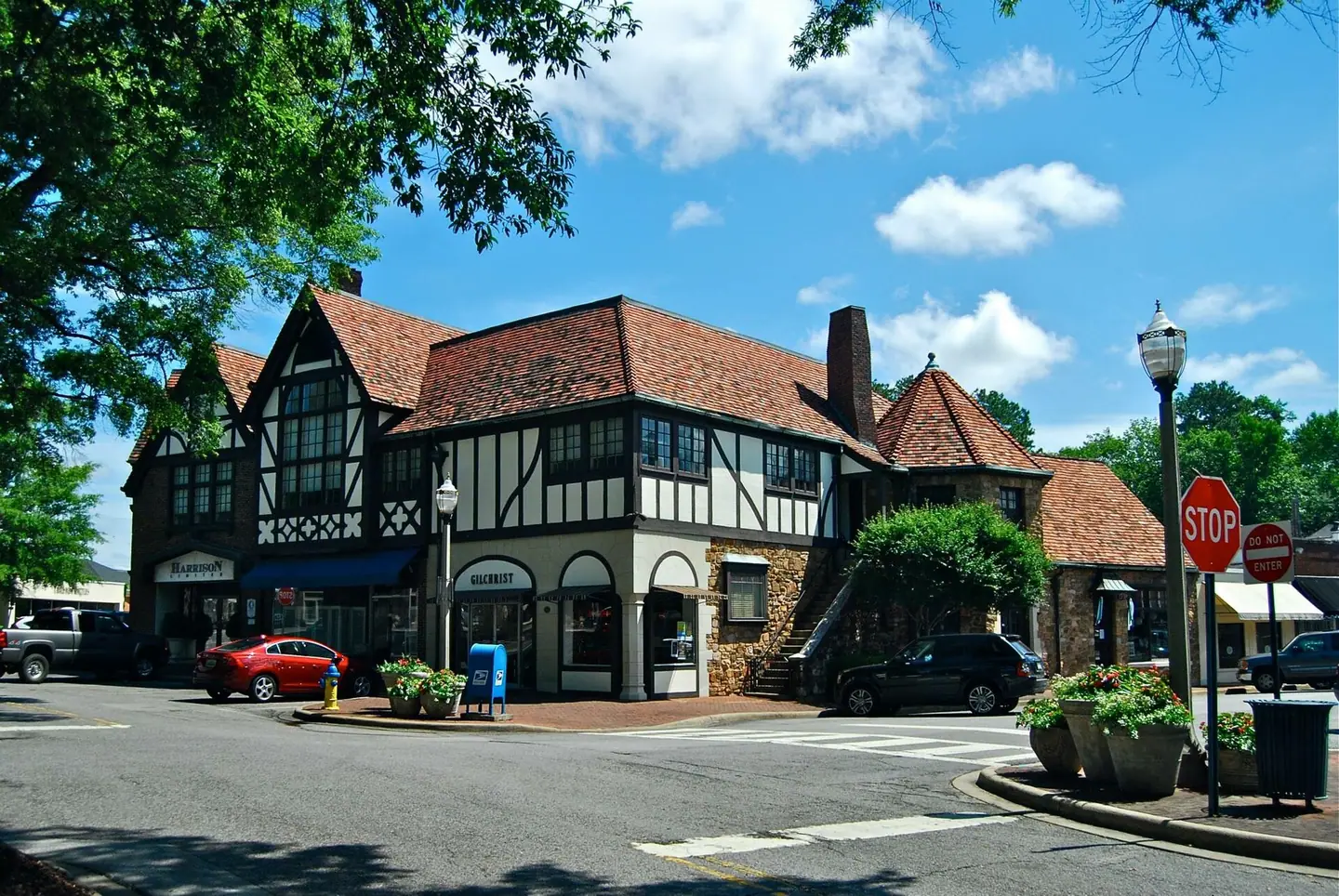 Half-timbered Tudor-style Mountain Brook Estates Building on a village street corner