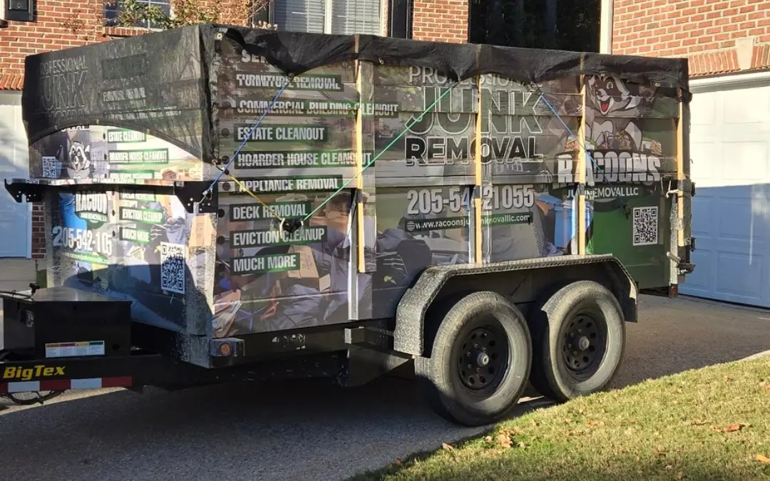 The Racoons dump trailer wrapped with its list of services